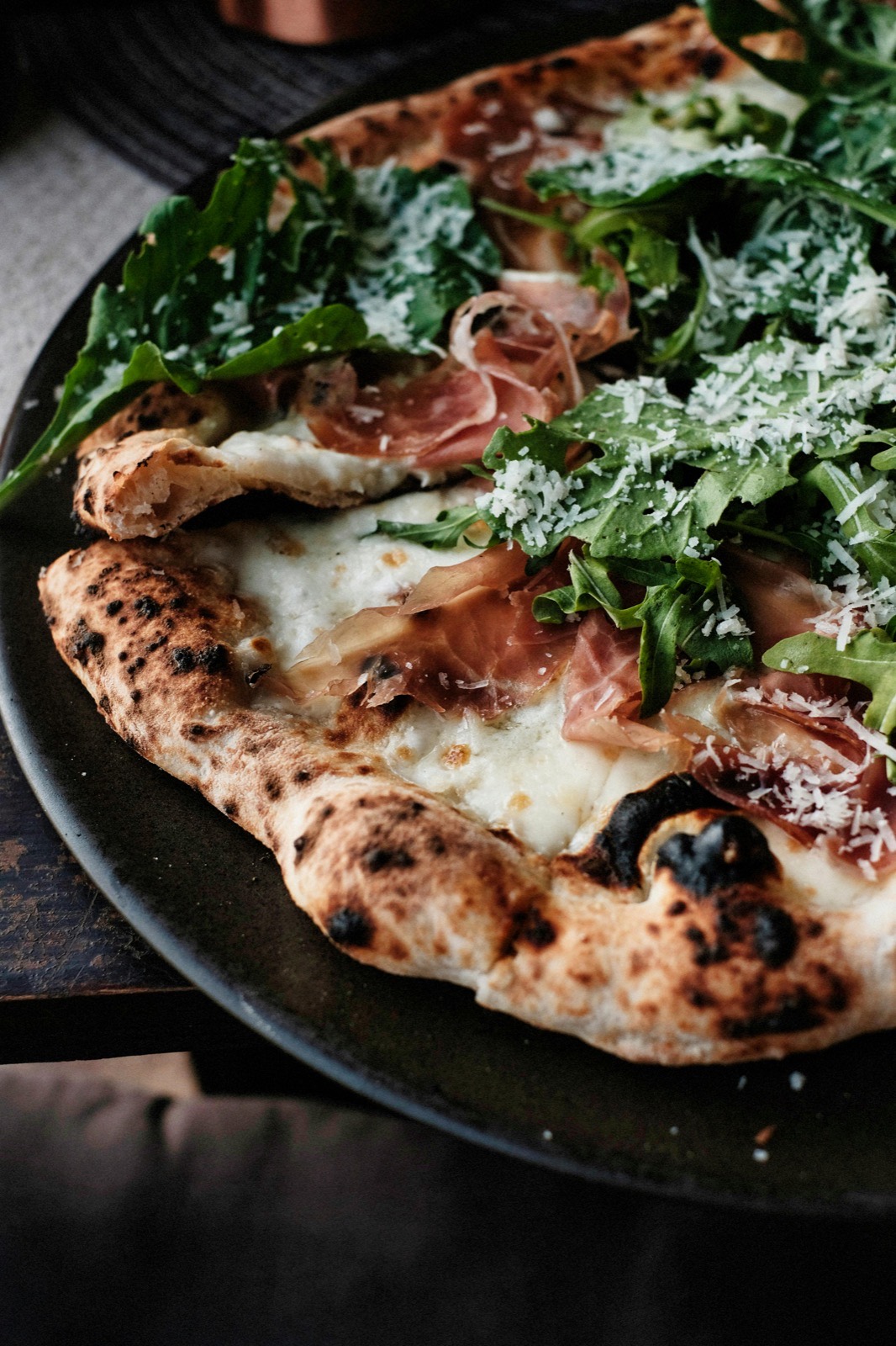 A stunning AI-generated pizza with blistered crust and vibrant toppings